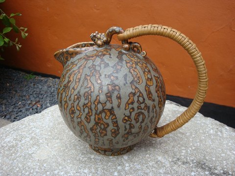 Arne Bang jug No. 151 with braided bamboo handle in gray / brown glaze. 
Height 15.5 cm. 
5000 m2 showroom.