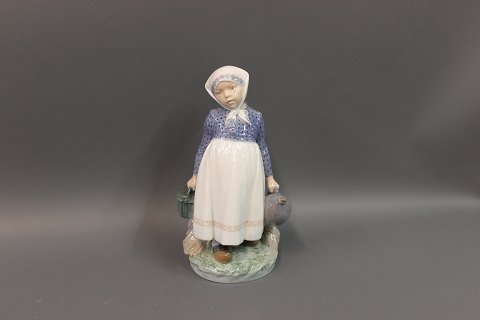 Royal Copenhagen  No. 815, country girl with lunch.  Height 22 cm. 5000 m2 
showroom.