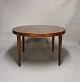 Round dining table with extensions in rosewood by Haslev Furniture from the 
1960s.
5000m2 showroom.