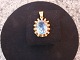 Pendant in 14 carat with beautiful light blue stone designed by O.W. from the 
1960s. 
5000m2 showroom.
