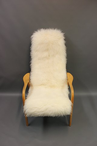Armchair designed by Swedish Yngve Ekstrom. Padded with real long-haired 
sheepskin. 5000m2 showroom