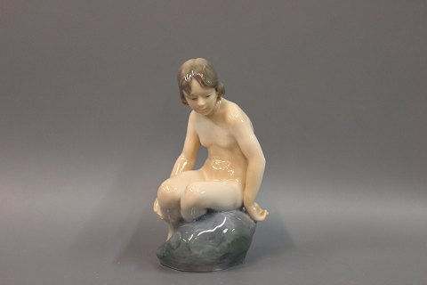 Royal. Figure no. 4027, Naked lady on a stone. Height 15 cm.  
5000 m2 showroom.