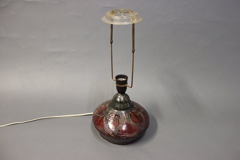 Tablelamp in ceramic with dark red and Brown glaze.
5000me showroom.
