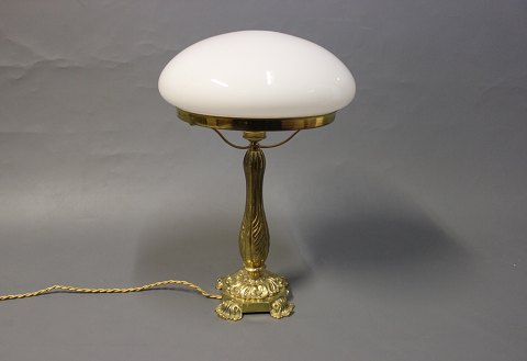 Tablelamp in brass with beautifully foot and White glass dome. 
5000m2 showroom.