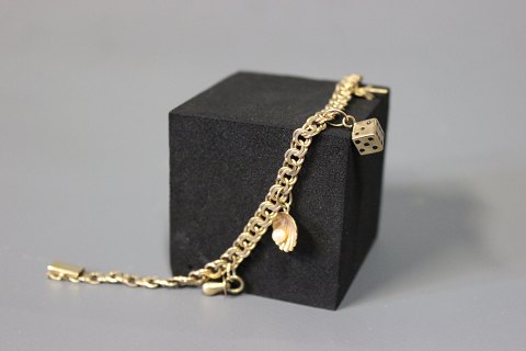Bismark bracelet with 4 charms in 8 ct. gold by Hermann Siersbøl.
5000m2 showroom.
