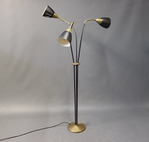 Three armed Black floorlamp in brass of unknown design.
5000m2 showroom.
