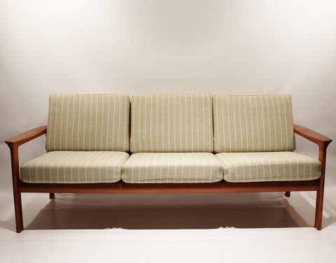 Three seater sofa of teak and cushions upholstered in light green wool fabric by 
Svend Ellekær from the 1970s.
5000m2 showroom.