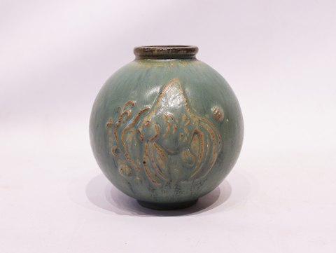 Ceramic vase in turquoise colors decorated with fish motif, no. 18, by Arne 
Bang.
5000m2 showroom.