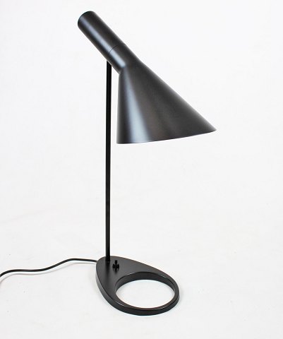 Dark grey table lamp designed by Arne Jacobsen in 1957 and manufactured by Louis 
Poulsen.