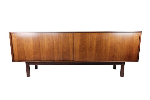Sideboard in rosewood with sliding doors designed by Omann Junior from the 
1960s.
5000m2 showroom.

