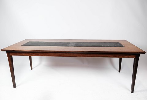 Coffee table in rosewood and black slate of Danish design from the 1960s. 
5000m2 showroom.
