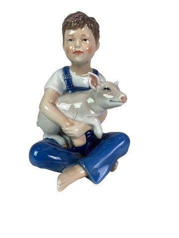 Royal Copenhagen porcelain figure, Boy with Pig, no.: 436. 
5000m2 showroom.
Great condition
