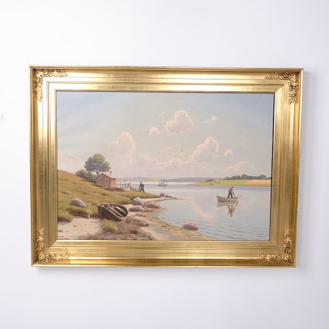 Painting on canvas depicting a coastal scene with fishermen in a gilt frame