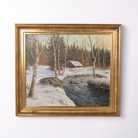 Signed painting on canvas depicting a snowy landscape, framed