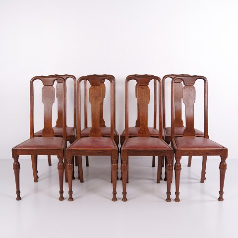 Set of 8 dining chairs in dark wood and red leather from the 1920s