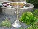 Large silver centerpiece in hallmarked silver with fine embossings.
45 cm in height and 31 cm in diameter.
5000 m2 showroom.