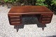 Free-standing rosewood desk.
5000m2 showroom.