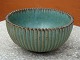 Arne Bang bowl No. 118 with knurled surface in greenish hue .Højde 7 cm diameter 
and 13 cm 5000 m2 showroom