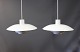 2 White PH4 pendants designed by Poul Henningsen and manufactured by Louis 
Poulsen.
5000m2 showroom.
