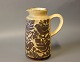 Ceramic jug in brown colors with bird motifs by Michael Andersen & Son, numbered 
6427.
5000m2 showroom.