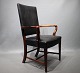 Armchair in walnut and with original black leather upholstery by Fritz 
Henningsen, 1940s.
5000m2 showroom.