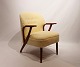 Easy chair upholstered in sheep wool and with arms of dark wood of danish design 
from the 1960s.
5000m2 showroom.