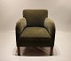 Easy chair upholstered with green fabric of danish design from the 1960s.
5000m2 showroom.