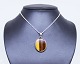 Pendant of 925 sterling silver and brown/yellow stone stamped N.E. From.
5000m2 showroom.