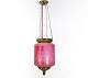 Antique pendant of pink opaline glass with brass edge and suspension from around 
1860.
5000m2 showroom.