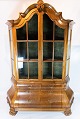 Rococo shaped glass cabinet of hand polished walnut by the furniture maker C. B. 
Hansen from Copenhagen around the year 1910.
5000m2 showroom.