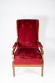 Armchair upholstered with red velvet and mahogany designed by Fritz Henningsen. 
5000m2 showroom.