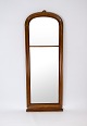 Tall mirror of mahogany from around the 1860s. 
5000m2 showroom.