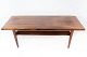 Coffee table in rosewood with shelf, of Danish design from the 1960s.
5000m2 showroom.
