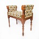 Piano bench of walnut and upholstered with patterned fabric, from the 1910s.
5000m2 showroom.