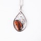 Pendant with silver necklace in silver and amber, unique design