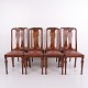 Set of 8 dining chairs in dark wood and red leather from the 1920s